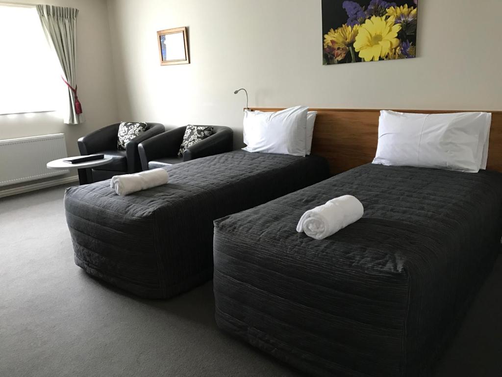 Postel nebo postele na pokoji v ubytování High Peaks Hotel