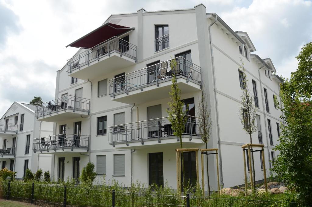 an exterior view of a white building at Residenz Margarete - Apt. 2.5 in Binz