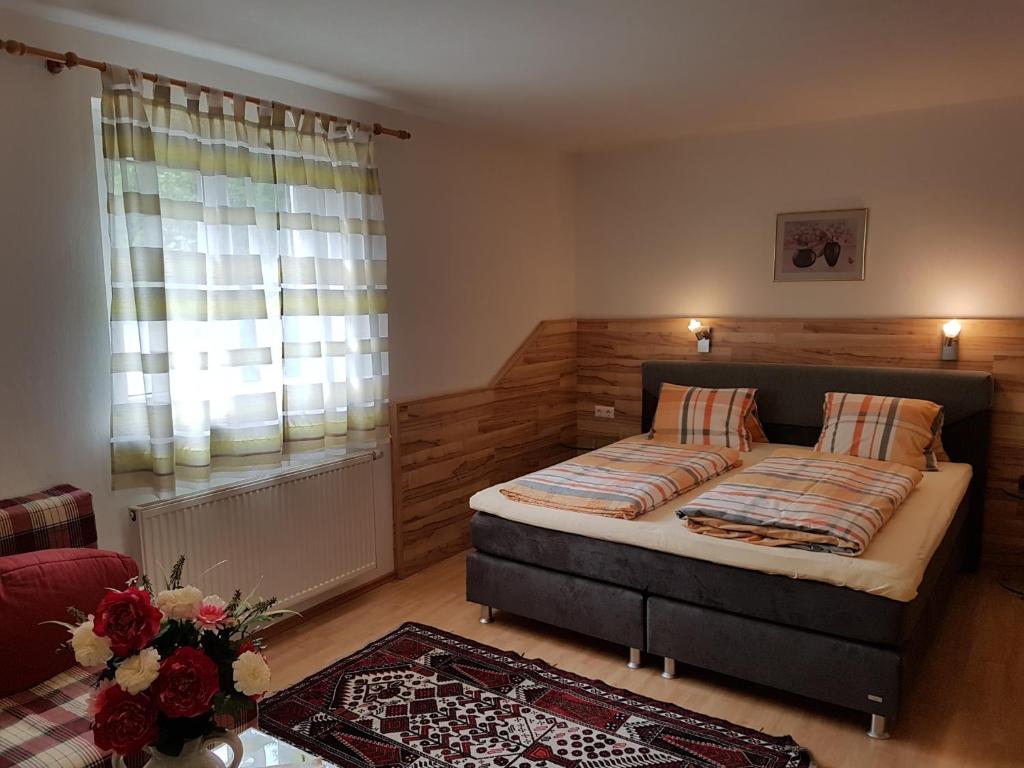 Postel nebo postele na pokoji v ubytování Hotel Gletschermühle