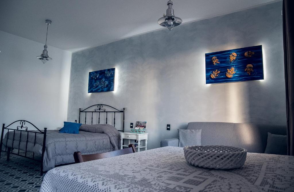 A bed or beds in a room at Ulisse Maison de Charme