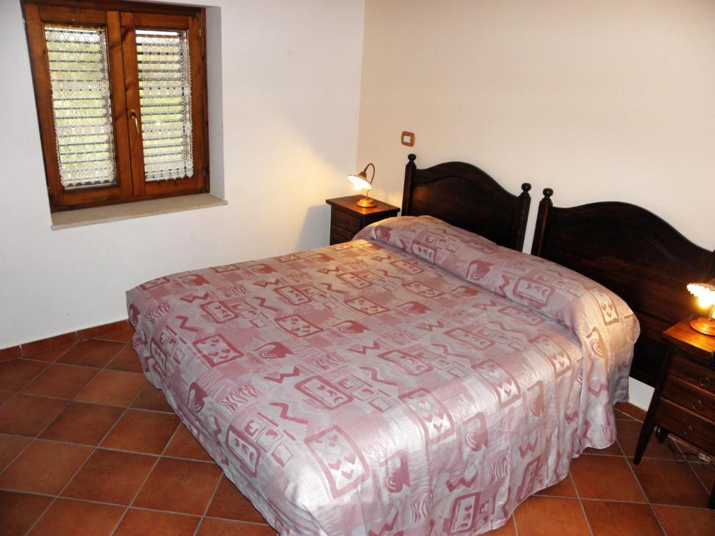 Posteľ alebo postele v izbe v ubytovaní Agriturismo La Colombaia