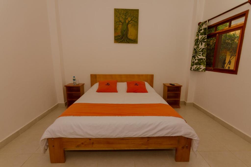 Postel nebo postele na pokoji v ubytování Tuzco Lodge
