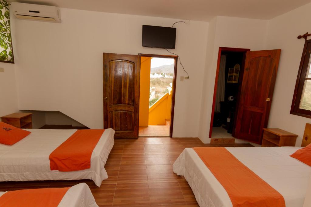 Postel nebo postele na pokoji v ubytování Tuzco Lodge