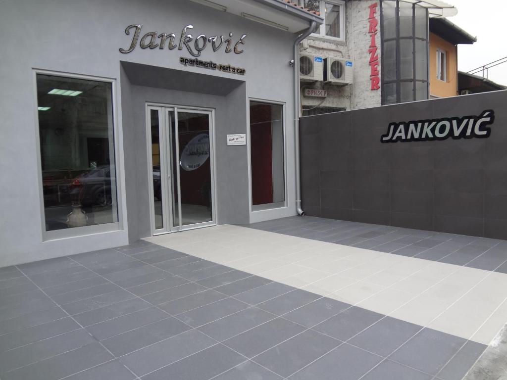 a store front with glass doors on a building at Apartments Jankovic in Belgrade