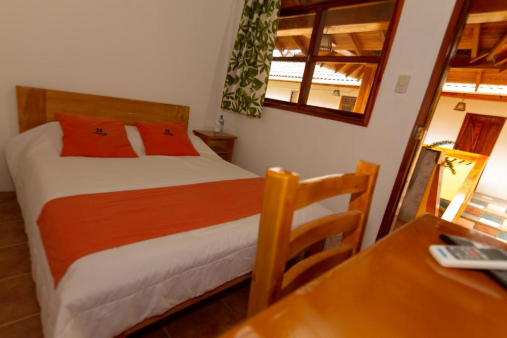 Postel nebo postele na pokoji v ubytování Tuzco Lodge