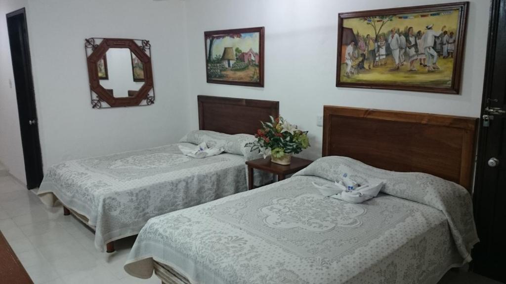 Postel nebo postele na pokoji v ubytování Hotel San Clemente