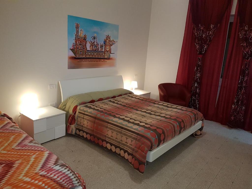 Postel nebo postele na pokoji v ubytování B&B Nonna Rosaria