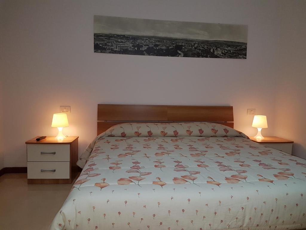 Postel nebo postele na pokoji v ubytování B&B Nonna Rosaria