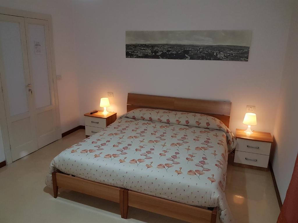 Postel nebo postele na pokoji v ubytování B&B Nonna Rosaria