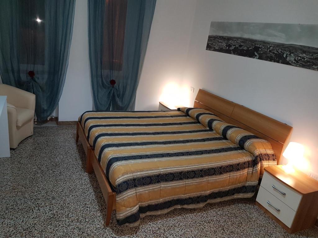 Postel nebo postele na pokoji v ubytování B&B Nonna Rosaria