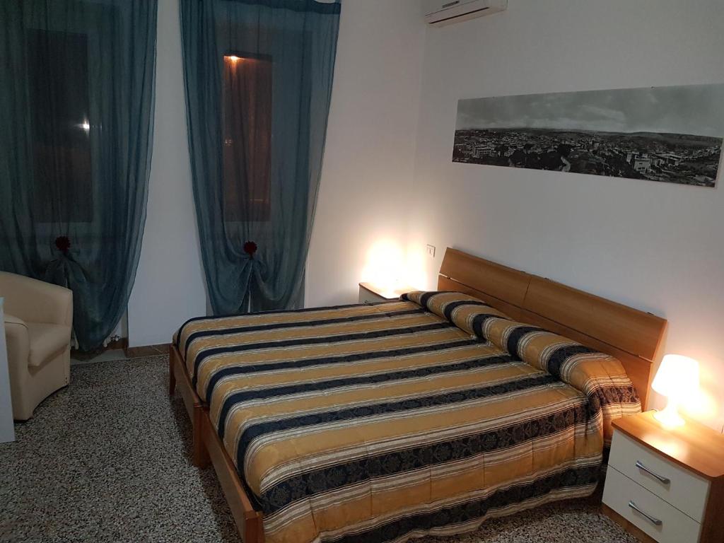 Postel nebo postele na pokoji v ubytování B&B Nonna Rosaria
