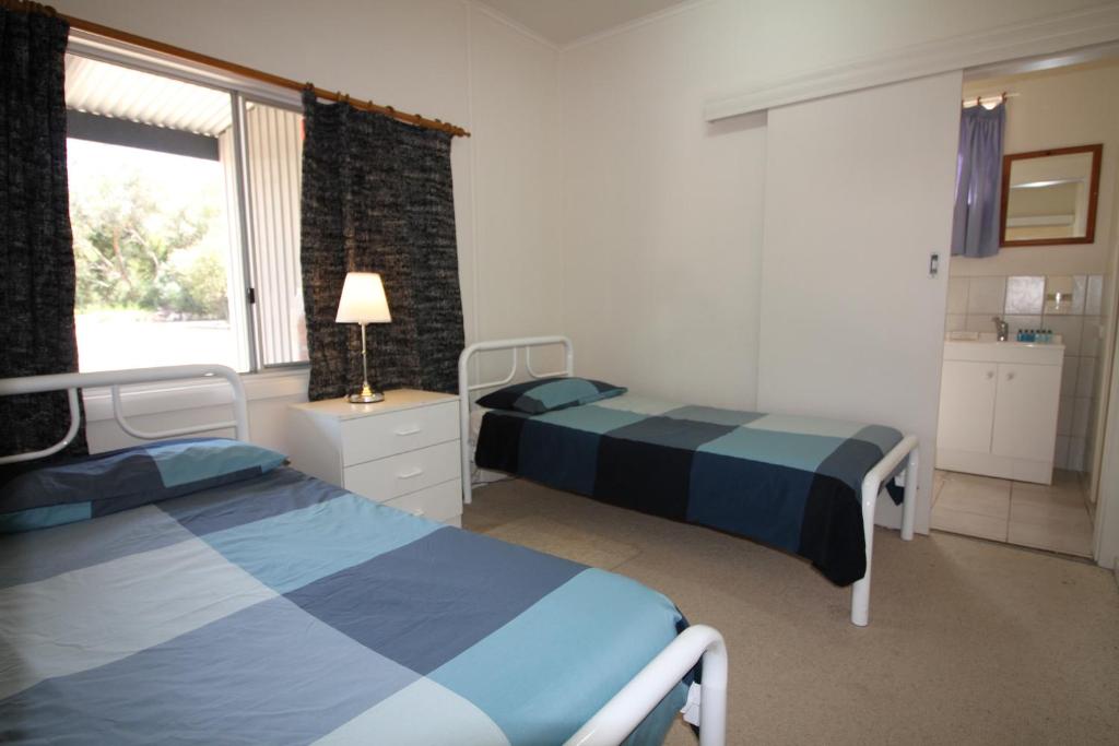 Postel nebo postele na pokoji v ubytování Kangaroo Island Coastal Villas