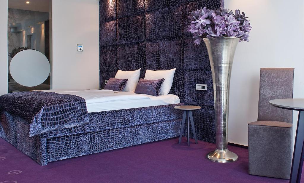 Postel nebo postele na pokoji v ubytování G Design Hotel