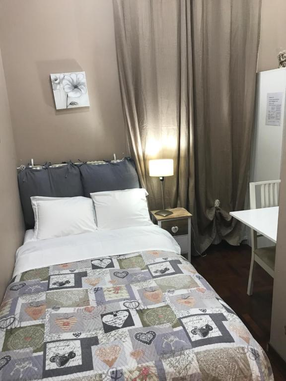 Łóżko lub łóżka w pokoju w obiekcie Morgagni House