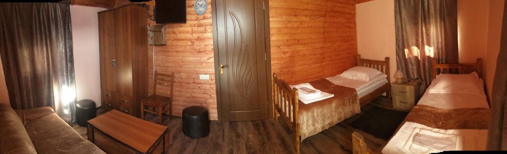 Postel nebo postele na pokoji v ubytování Cottage Gudauri