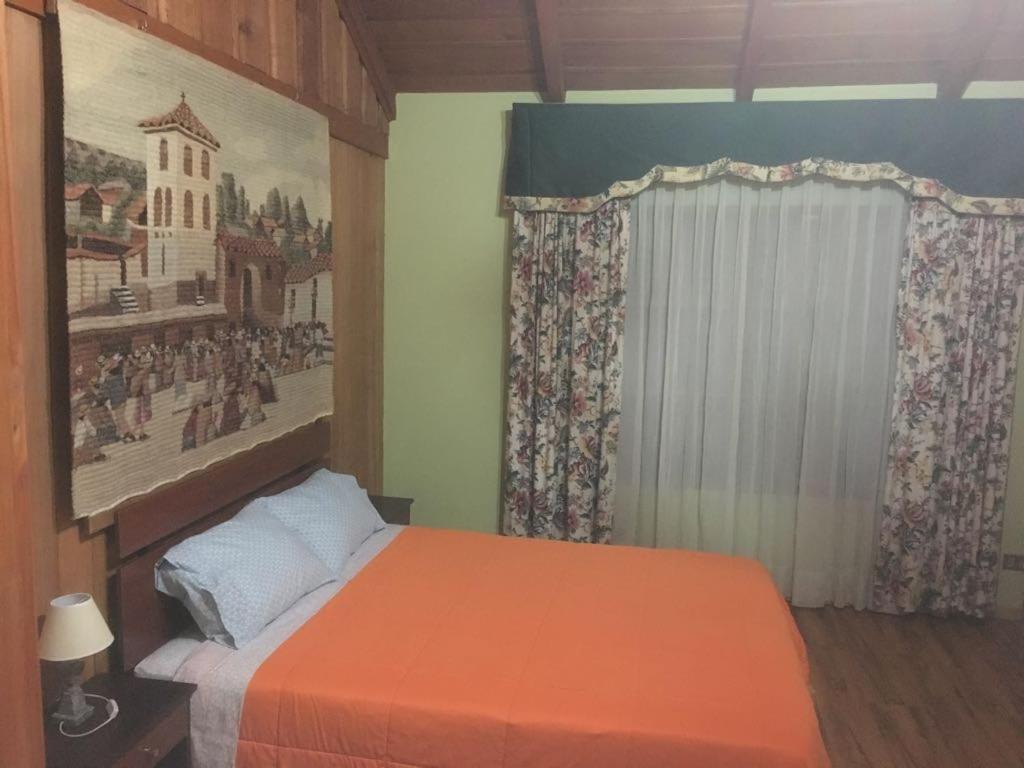 Postel nebo postele na pokoji v ubytování Hostal Kutralwe