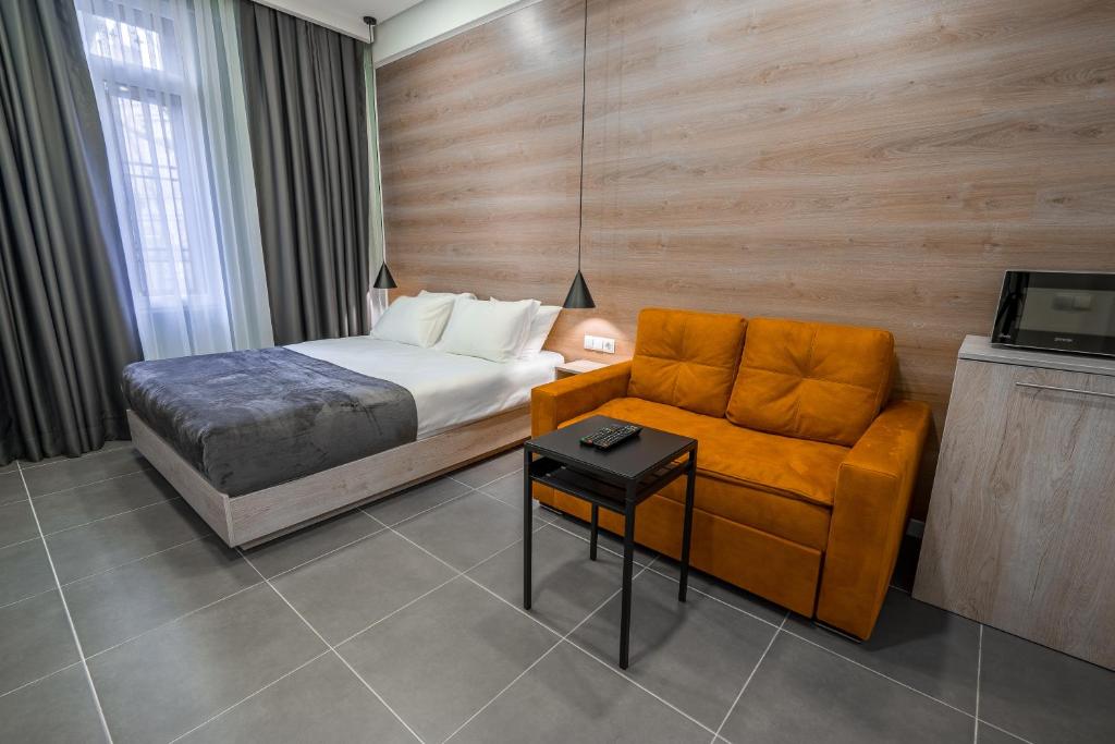 Postel nebo postele na pokoji v ubytování 8 Rooms Apartotel On Meidan