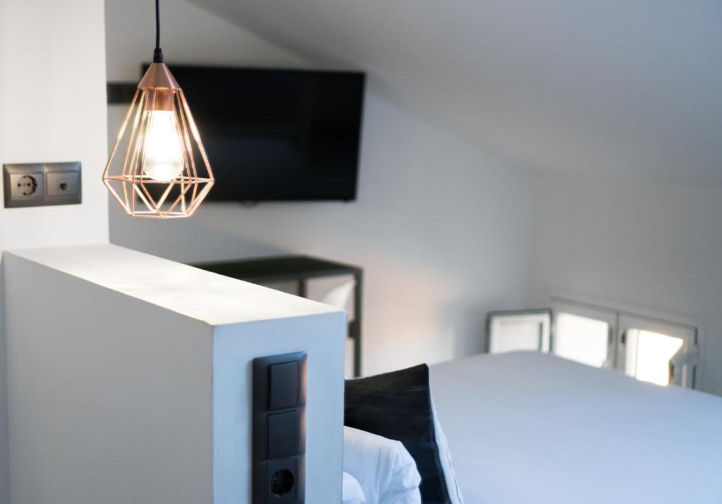 Posteľ alebo postele v izbe v ubytovaní The Lights City Rooms