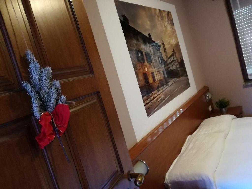 Postel nebo postele na pokoji v ubytování La Corte Albergo