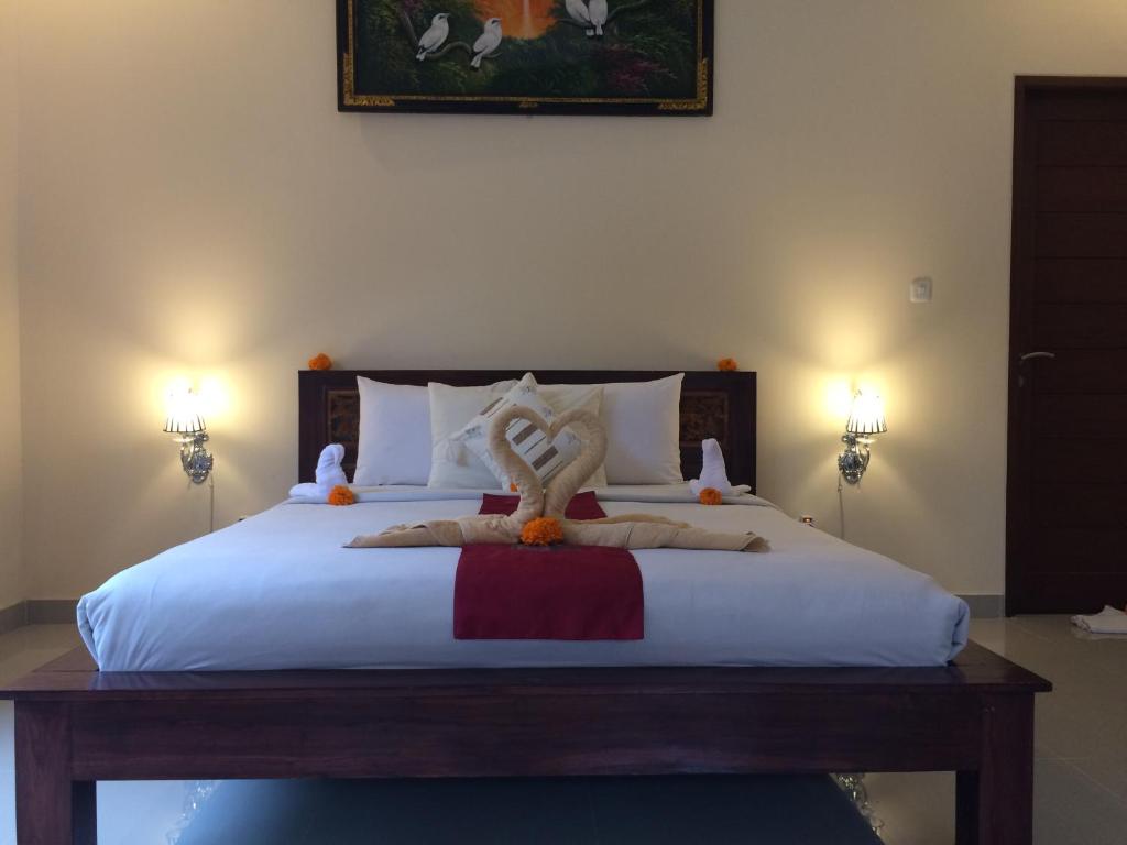 Letto o letti in una camera di Teba Junjungan Cottages