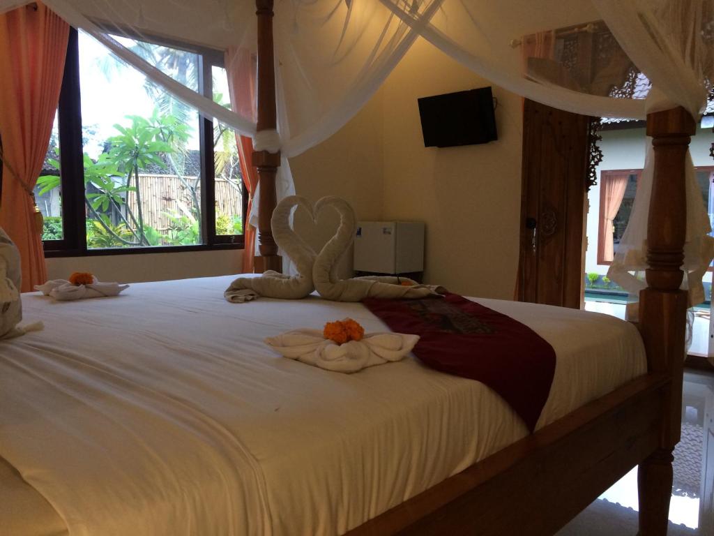 Letto o letti in una camera di Teba Junjungan Cottages