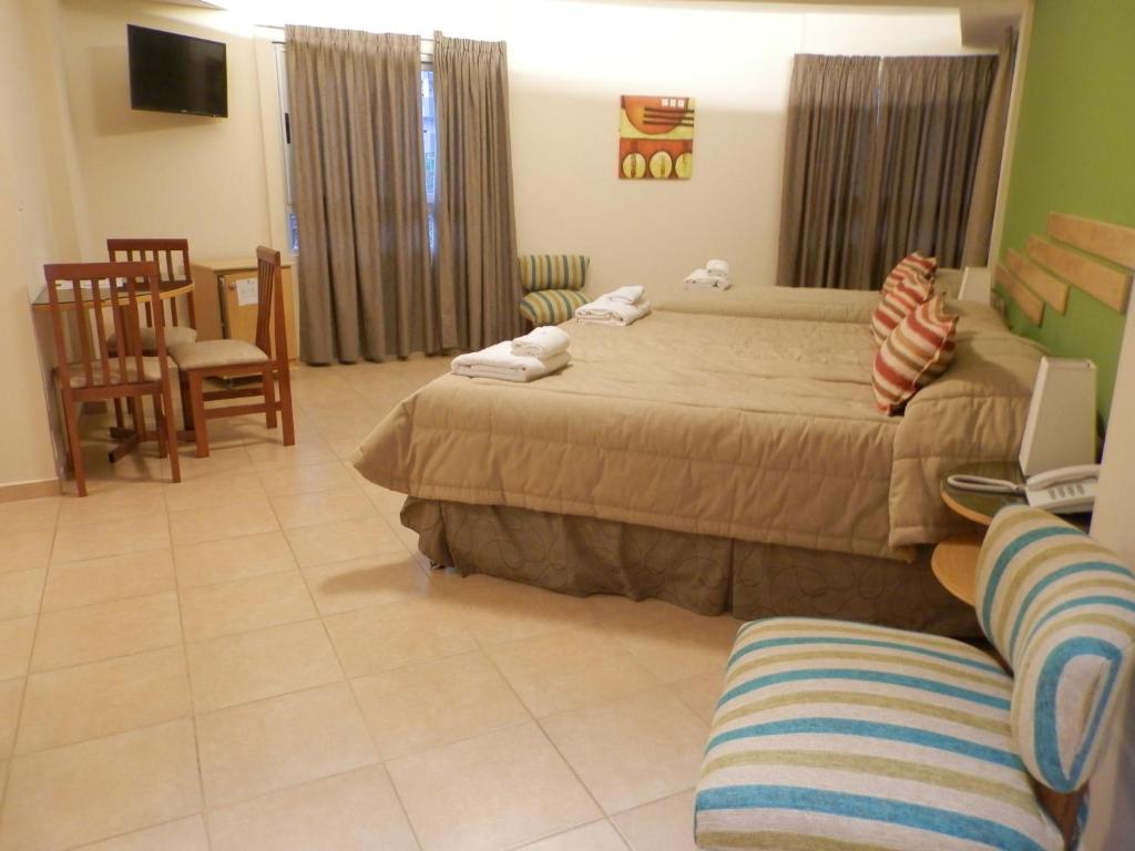 Postel nebo postele na pokoji v ubytování AVEMAR Apart Hotel