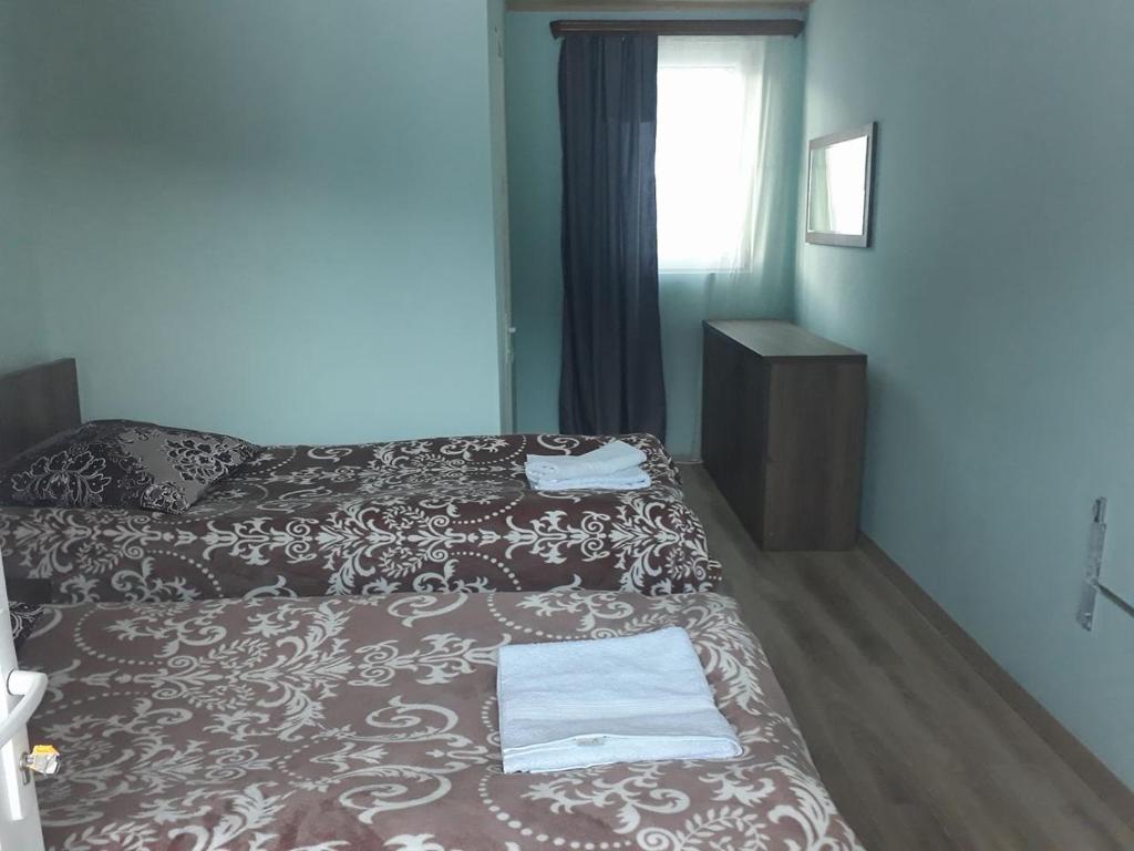 Postel nebo postele na pokoji v ubytování Guest House Khergiani