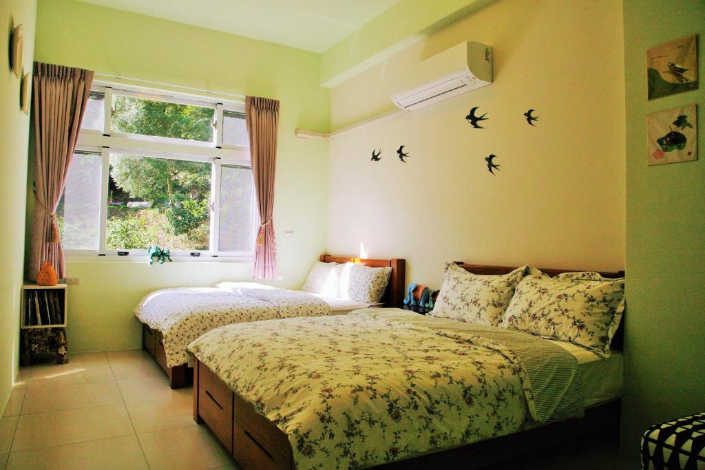 Postel nebo postele na pokoji v ubytování Yanzitao Pottery Coffee B&B