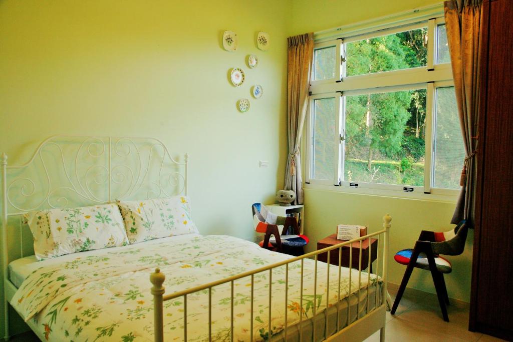 Postel nebo postele na pokoji v ubytování Yanzitao Pottery Coffee B&B