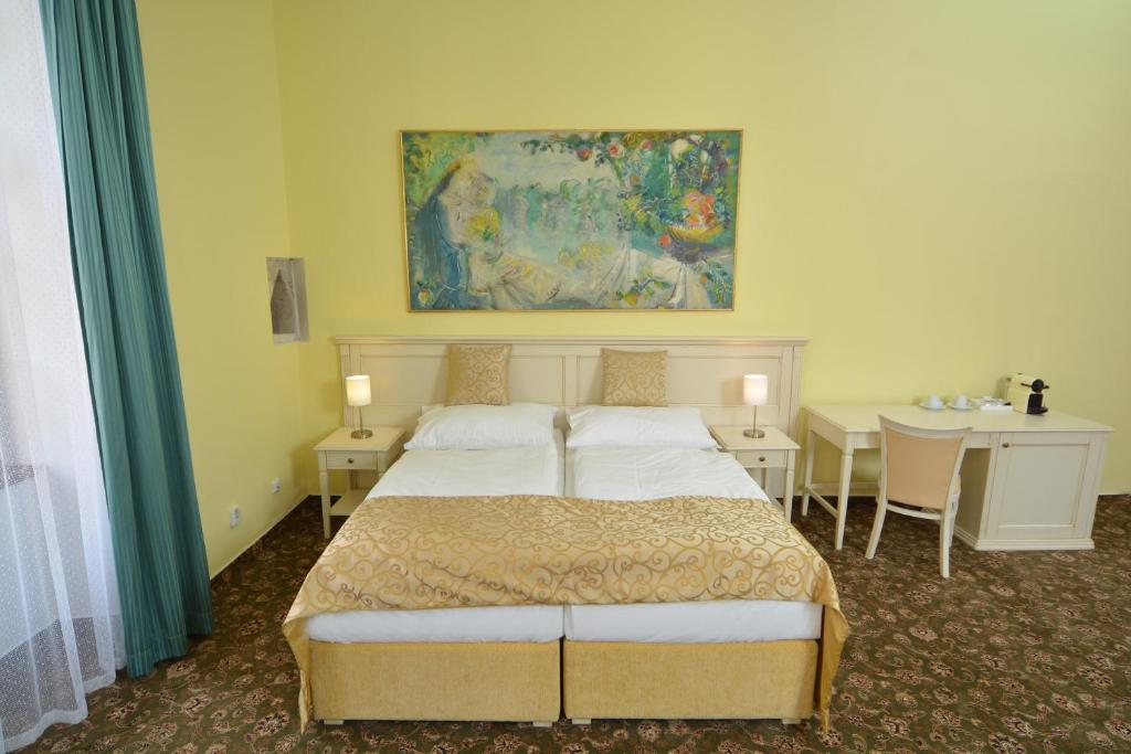 Postel nebo postele na pokoji v ubytování Hotel Metamorphis