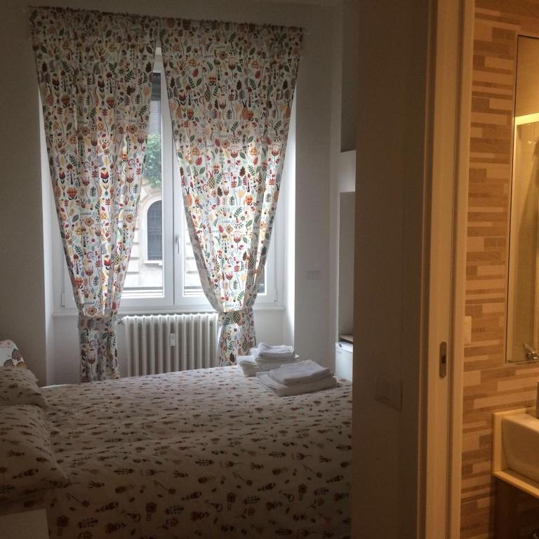 Кровать или кровати в номере B&B Via Fontana Milano