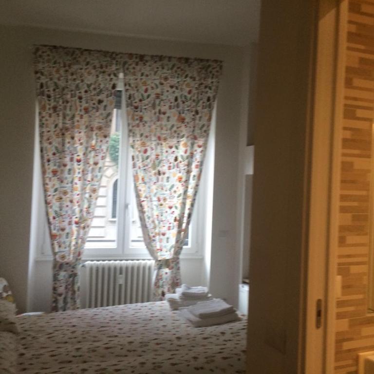 Кровать или кровати в номере B&B Via Fontana Milano