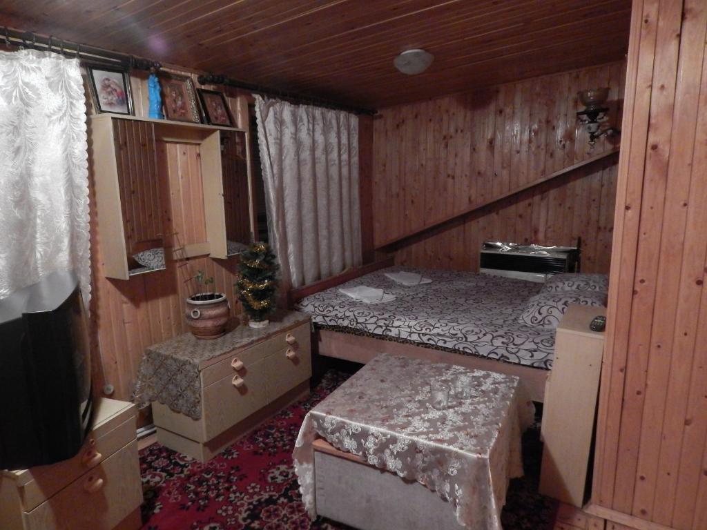 Postel nebo postele na pokoji v ubytování Садиба Достаток