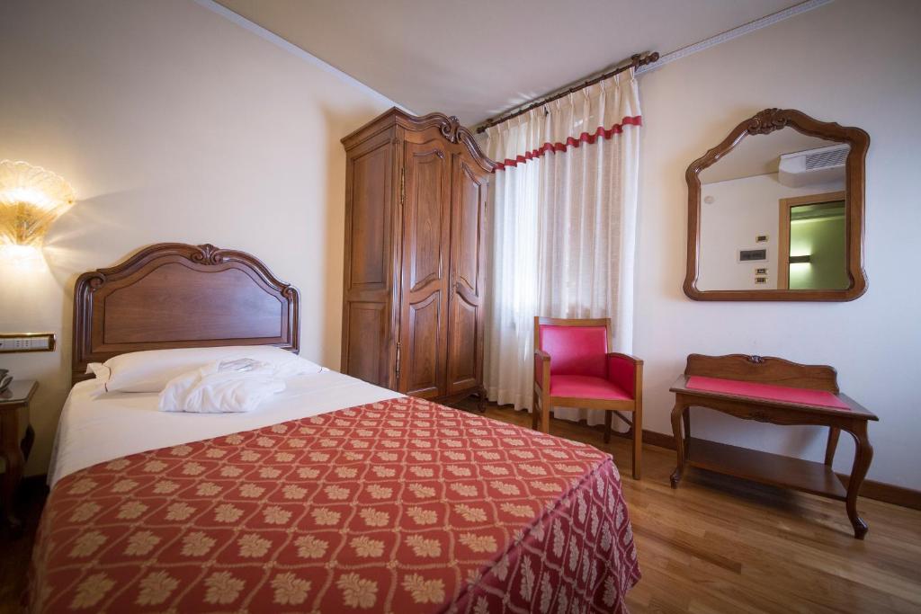 Postel nebo postele na pokoji v ubytování Hotel Spessotto