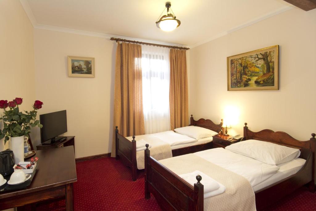 Postel nebo postele na pokoji v ubytování Hotel Retman