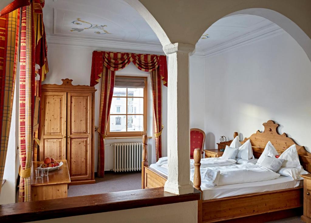 Postel nebo postele na pokoji v ubytování Romantic Hotel Excelsior