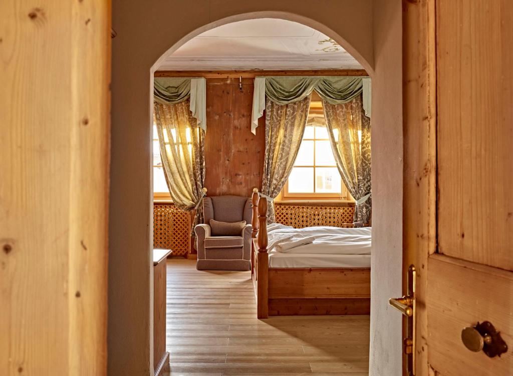 Postel nebo postele na pokoji v ubytování Romantic Hotel Excelsior