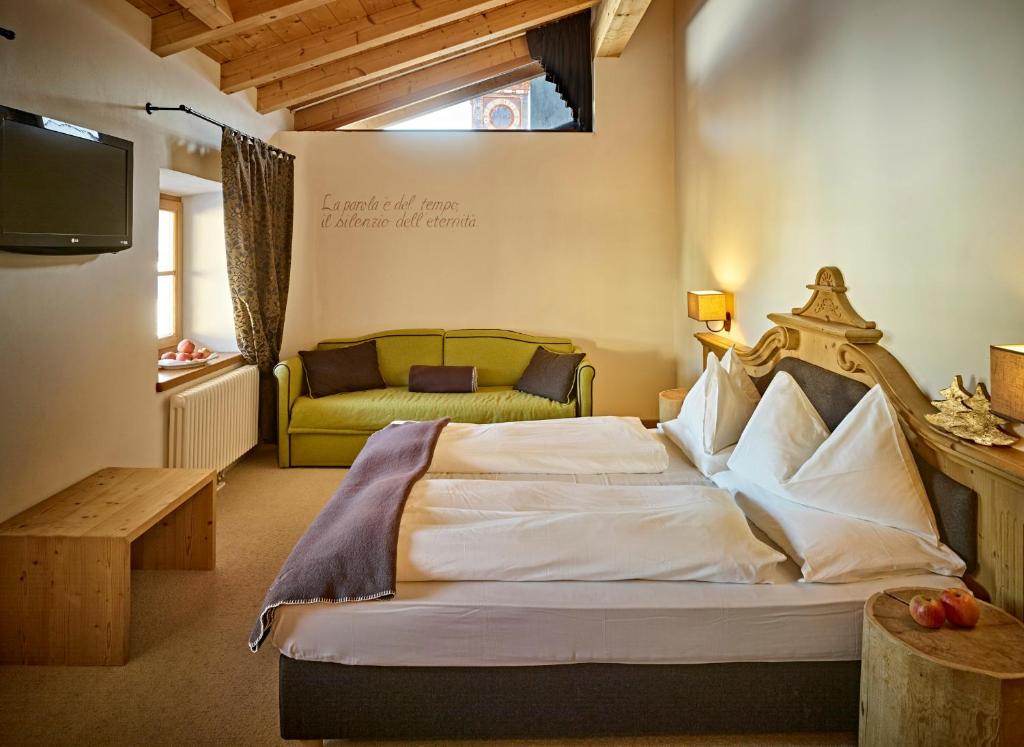 Postel nebo postele na pokoji v ubytování Romantic Hotel Excelsior
