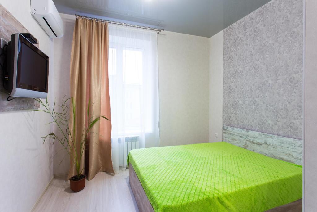Postel nebo postele na pokoji v ubytování Sumskaya ApartHotel