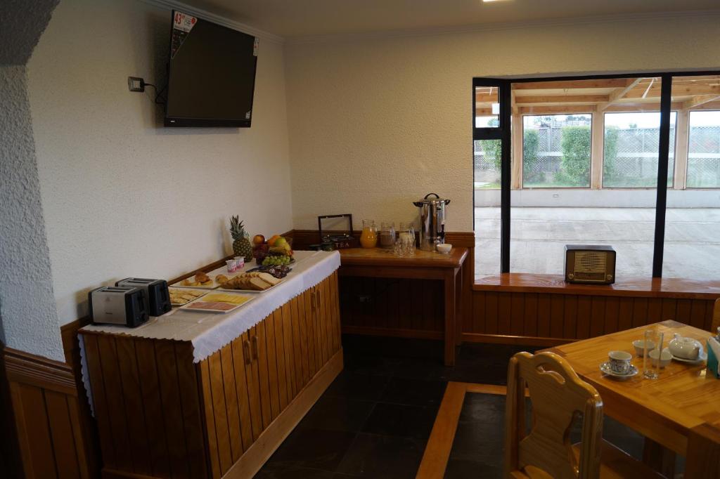 TV a/nebo společenská místnost v ubytování Hostal Doble E Patagonia