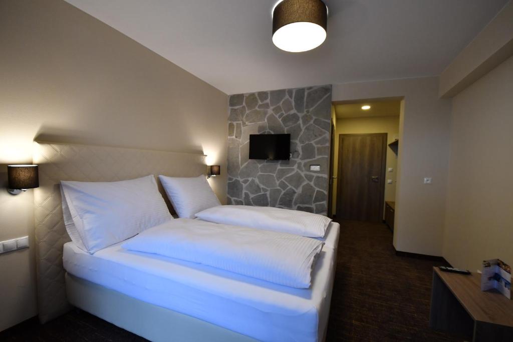 Postelja oz. postelje v sobi nastanitve Hotel Studničky