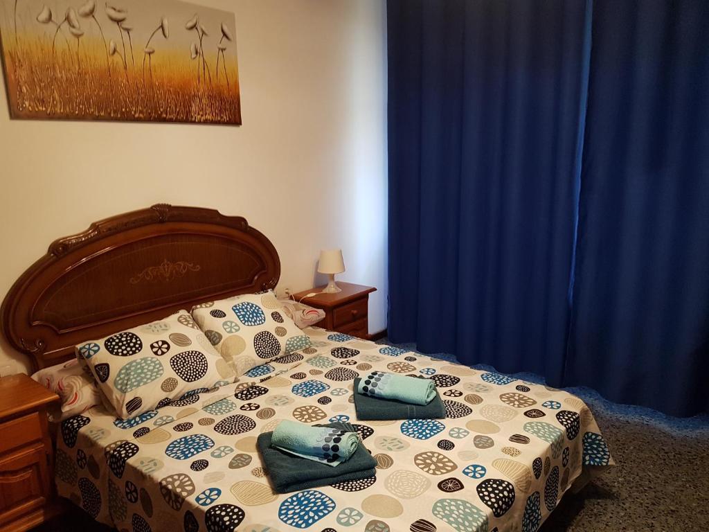 מיטה או מיטות בחדר ב-Aguilon