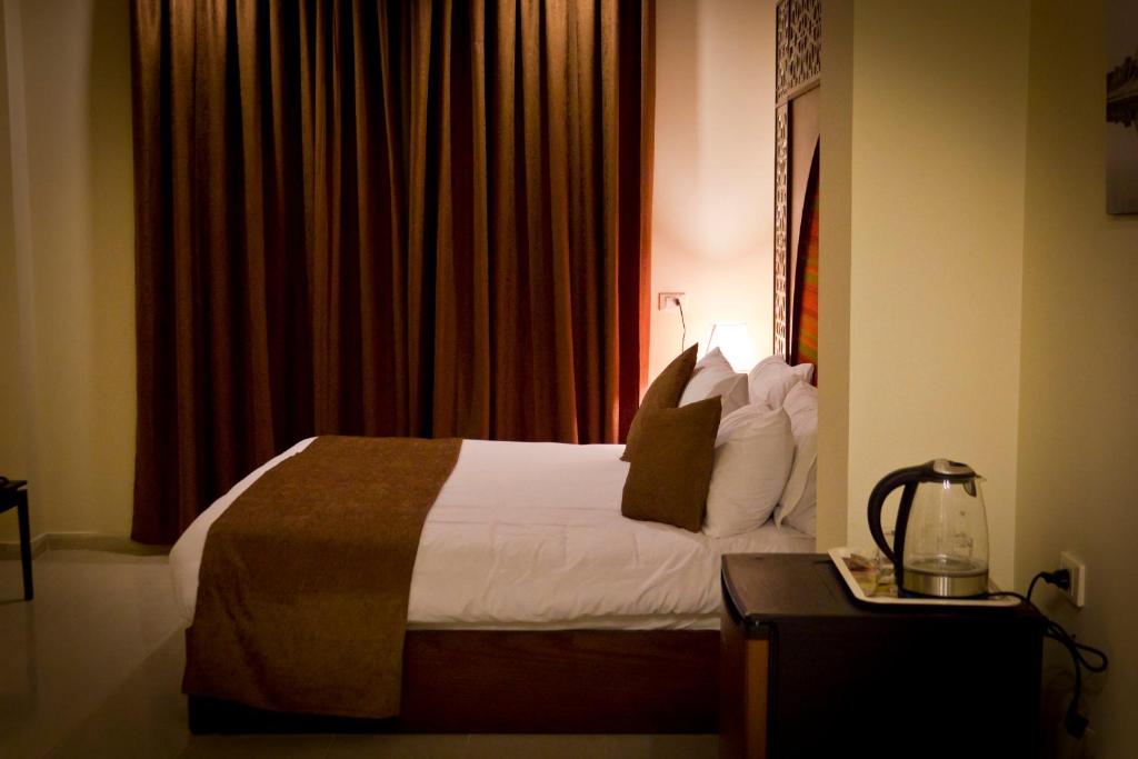 Postel nebo postele na pokoji v ubytování Pyramids Valley Boutique Hotel