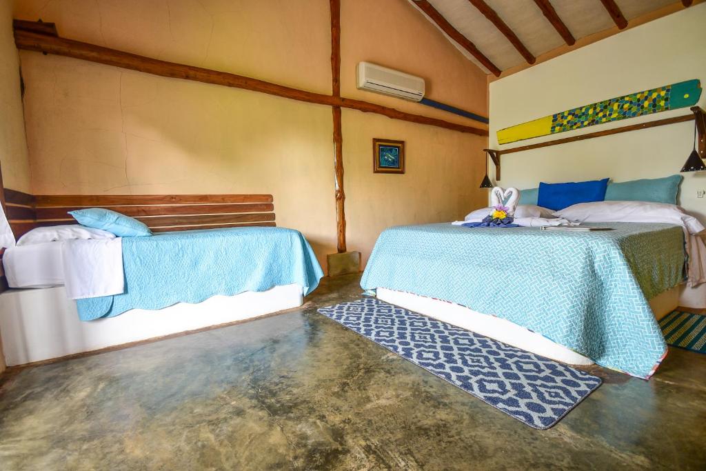 Postel nebo postele na pokoji v ubytování Casa Lajagua
