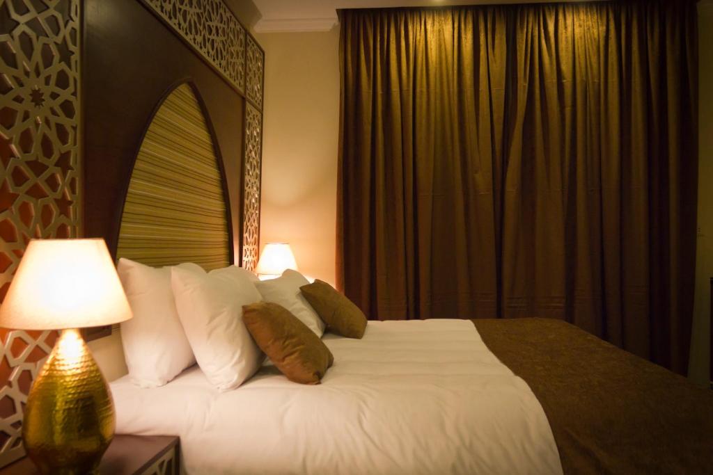 Postel nebo postele na pokoji v ubytování Pyramids Valley Boutique Hotel