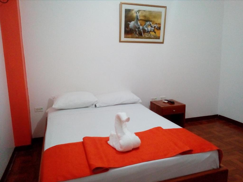 Postel nebo postele na pokoji v ubytování Hostal El Pinzón