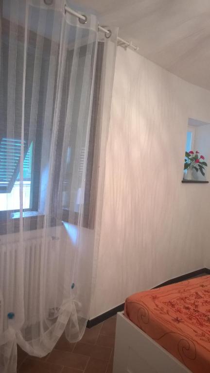 Postel nebo postele na pokoji v ubytování A cà di Bafirussi