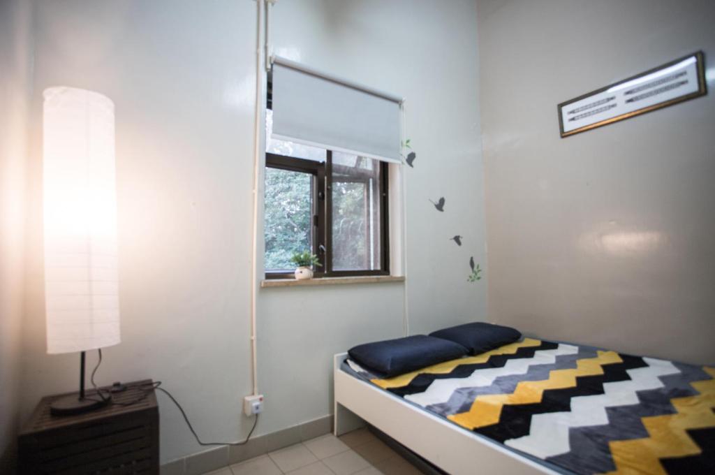 Letto o letti in una camera di YHA Ngong Ping SG Davis Youth Hostel