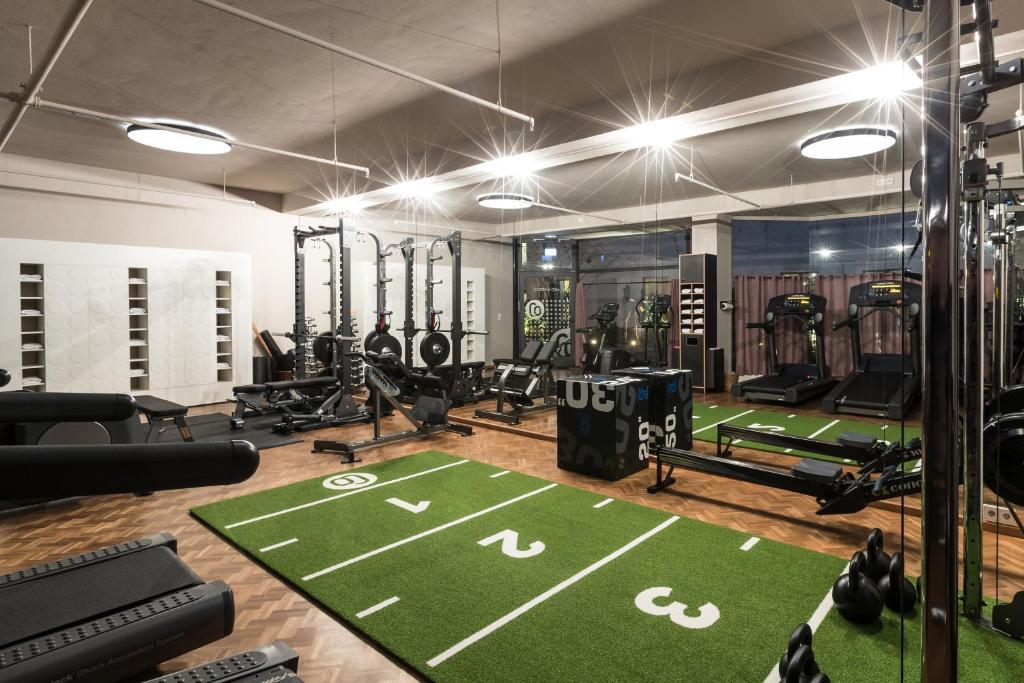 a gym with a football field on the floor at CORTIINA Hotel in Munich