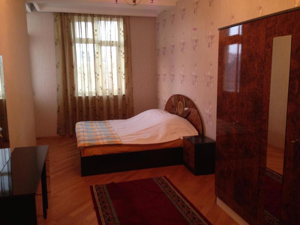 Apartment at Jafar Khandan 54 tesisinde bir odada yatak veya yataklar